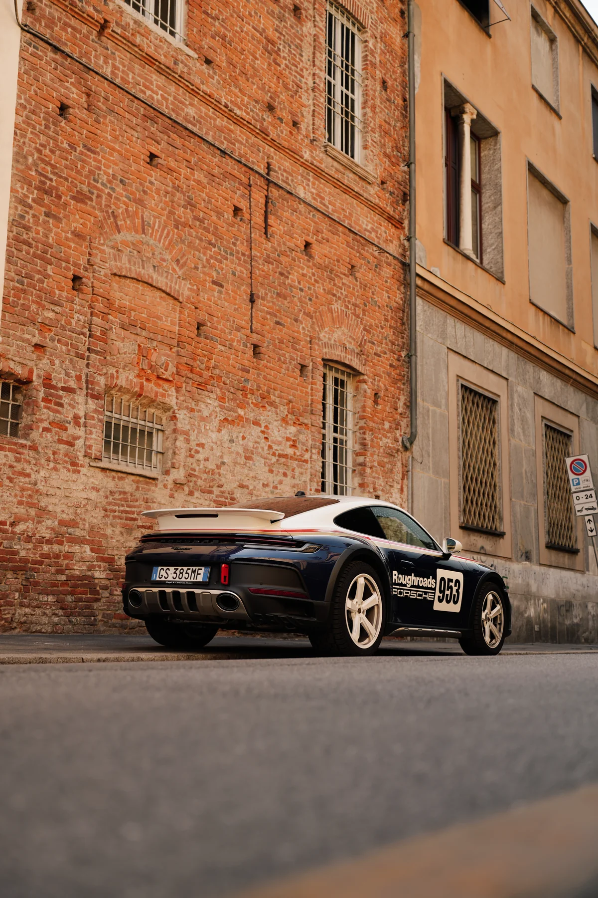 Abeba parked against a brick wall in Milan