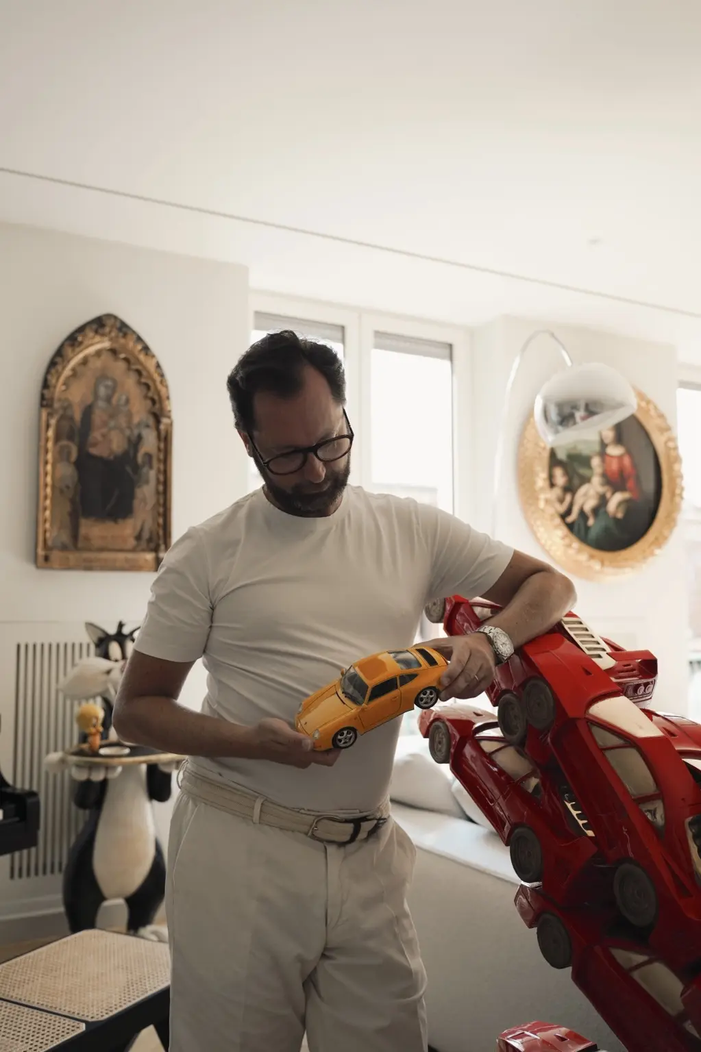 Andrea holding the yellow Porsche 993 model that began the story of Daisy