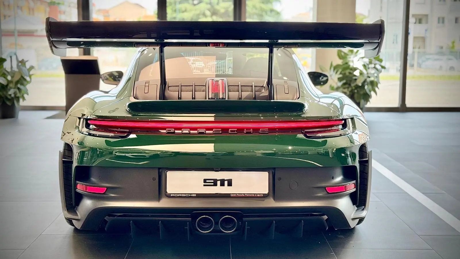 Rear view of Madame Claude in the Porsche showroom