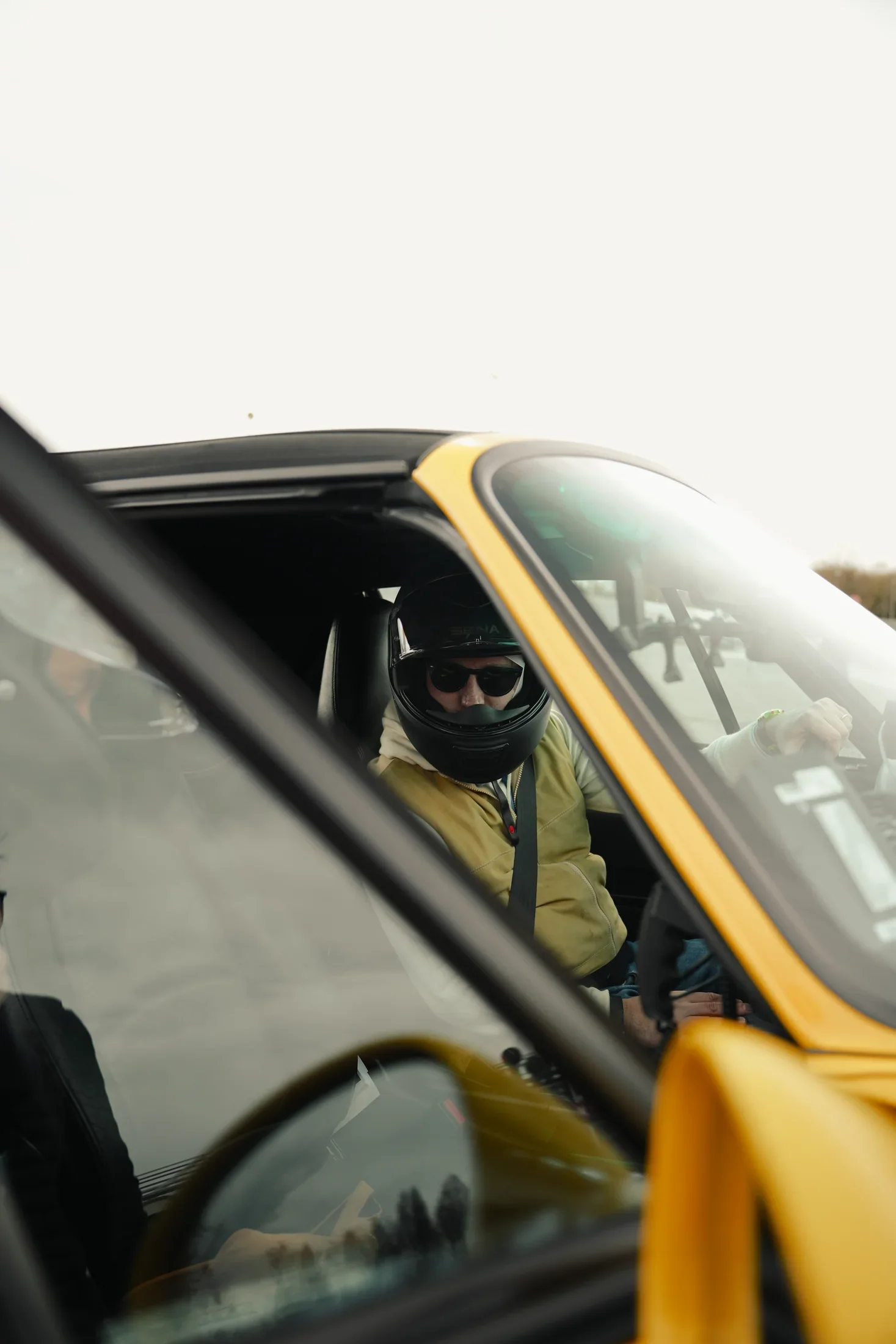 Driver inside Daisy wearing a helmet.