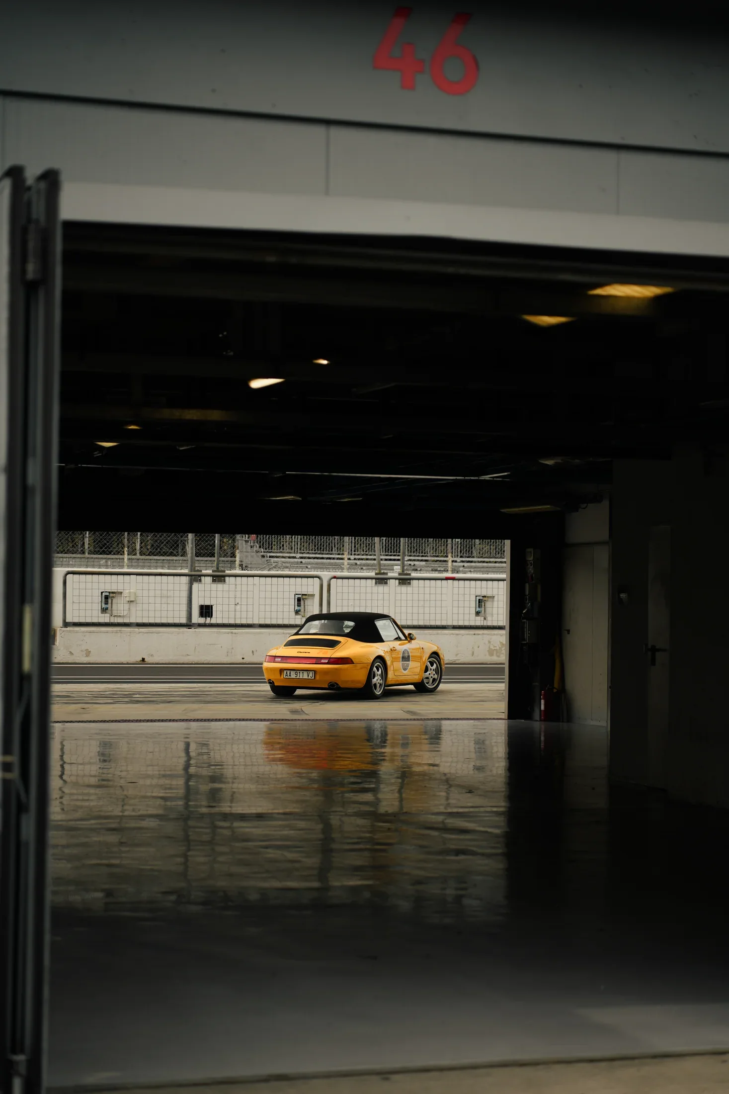 Daisy framed from inside a garage at the Autodromo.