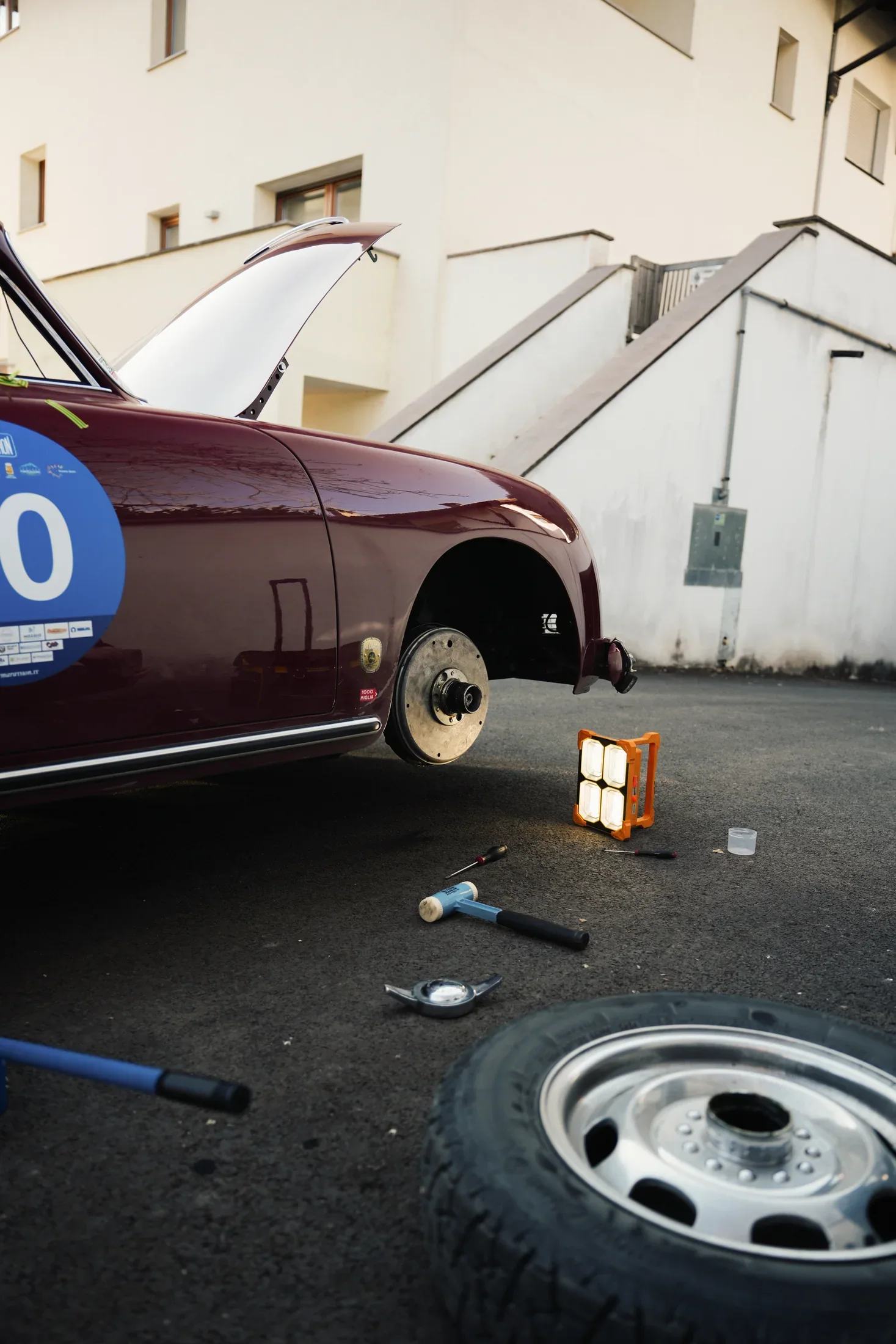 Historic cars climbing an alpine road during Winter Marathon.